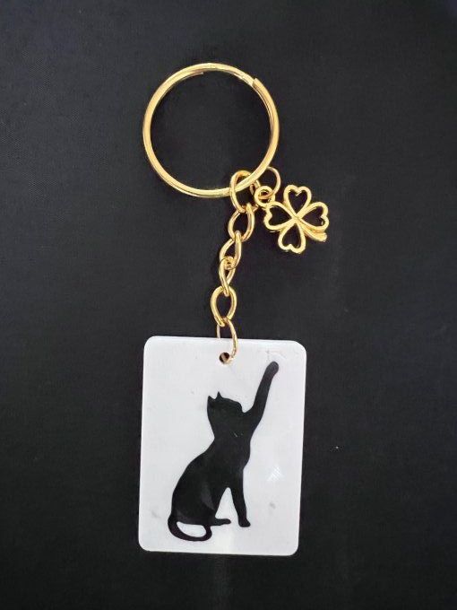 Porte clé chat patte en l'air